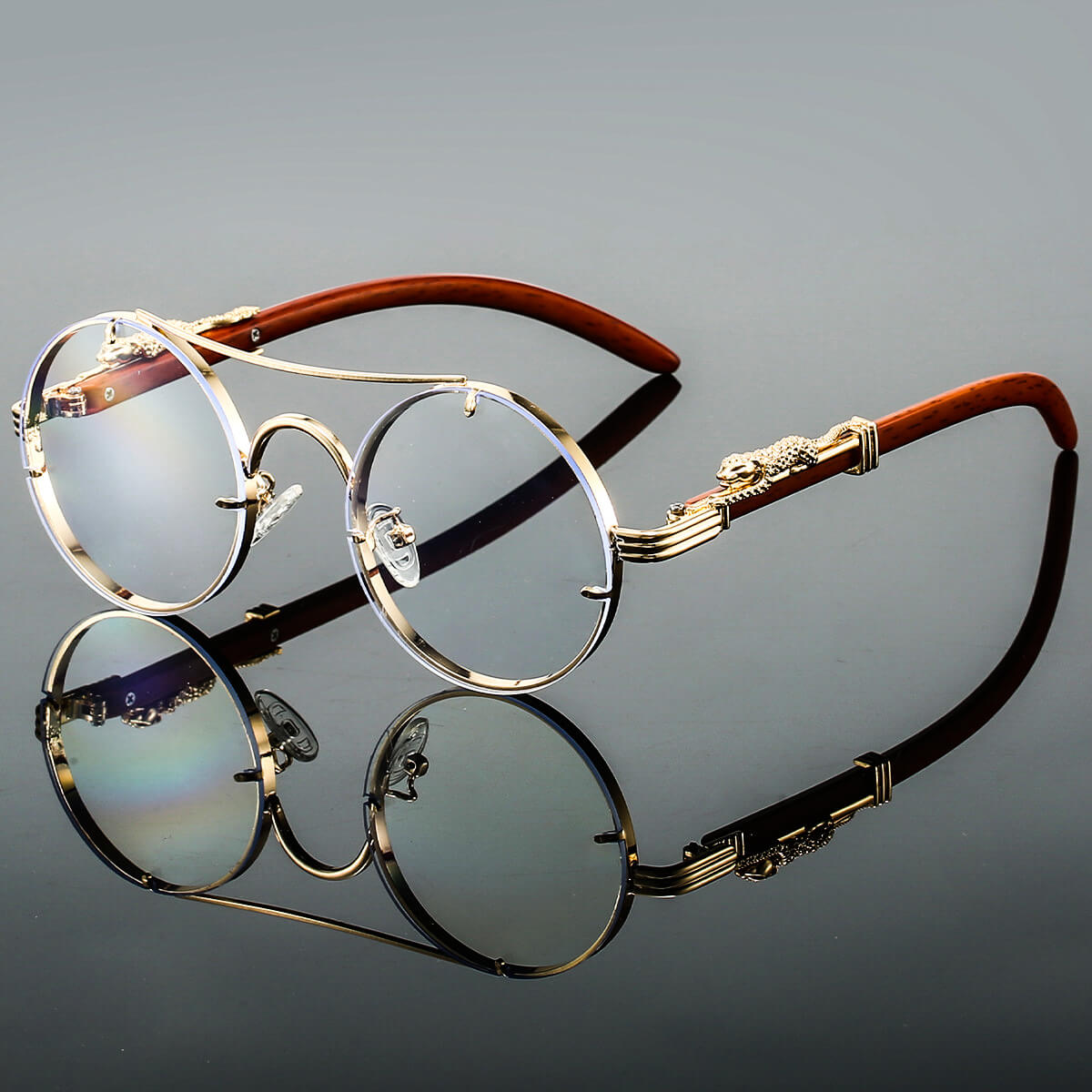 Unisexe Lunettes de Soleil Rondes Rétro avec Monture Dorée et Branches Décorées